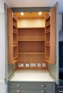Larder cupboard with built in sockets